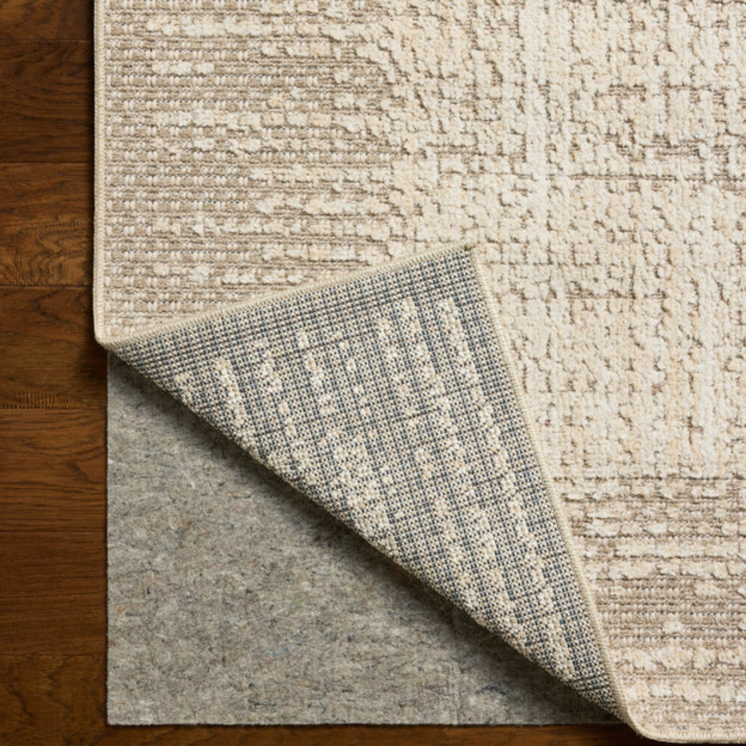 Edge and backing detail of Homvirex Bexley Natural Taupe rug