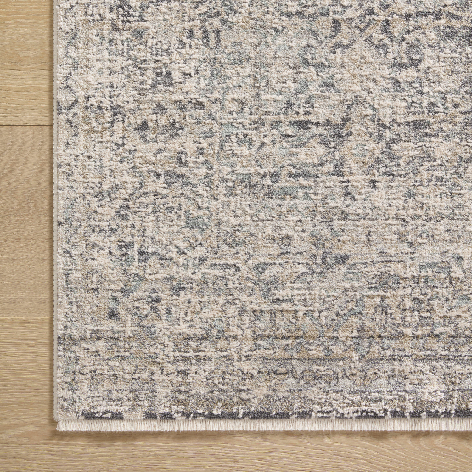 Corner detail of Homvirex Alie Stone Mist rug