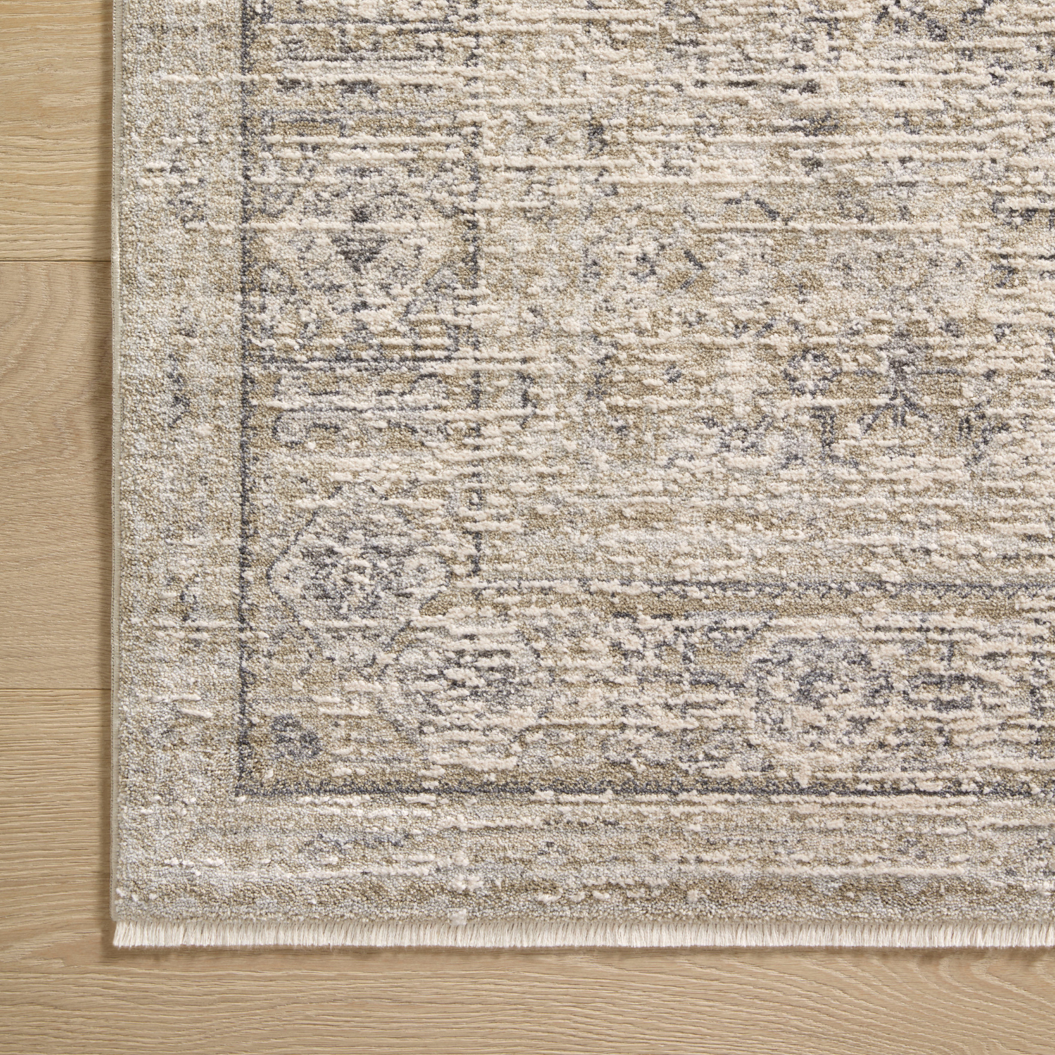 Corner detail of Homvirex Alie Taupe Dove round rug